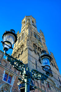 Low angle view of building against blue sky