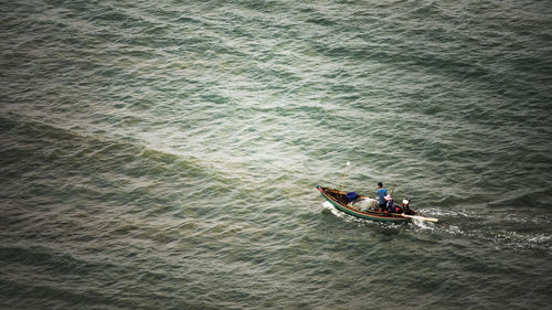 High angle view of man on boat sailing in river