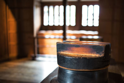 Close-up of old tea light on table at home