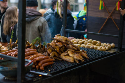 Sausages on barbecue at market