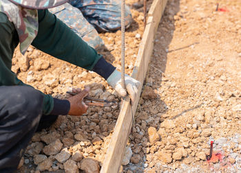 Midsection of man working at workshop