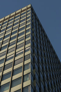 Low angle view of office building against clear sky