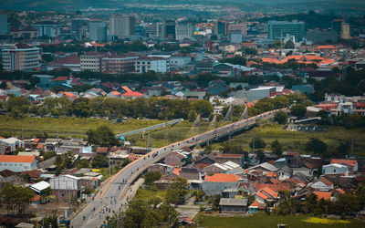 High angle view of street amidst buildings in town