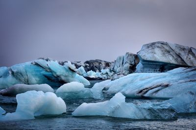 Scenic view of frozen sea against sky