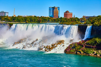 Scenic view of river in city