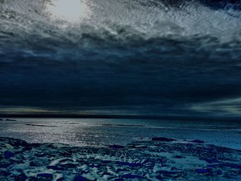 Scenic view of beach against sky during sunset