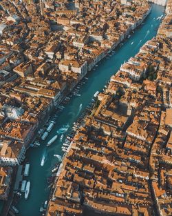 High angle view of river amidst buildings in city