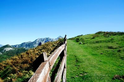 Scenic view of mountains against clear blue sky