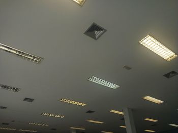 Low angle view of illuminated building against sky