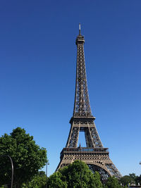 Low angle view of tower against blue sky