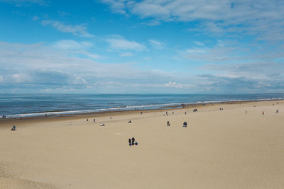 Scenic view of beach against blue sky