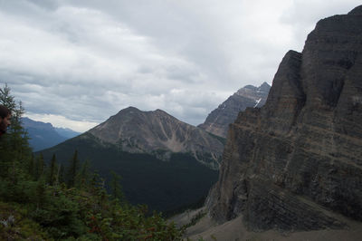Scenic view of mountains against cloudy sky