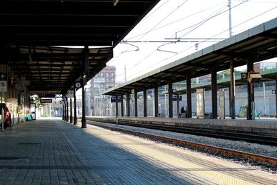 Empty railroad station platform on sunny day