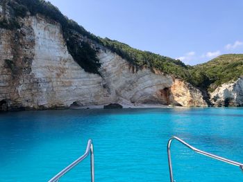 Scenic view of swimming pool by sea against sky