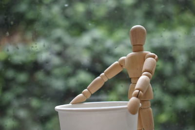 Close-up of stuffed toy on wood