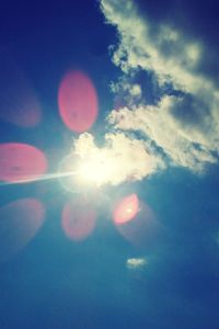 Low angle view of sun in sky