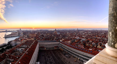 High angle view of city at sunset