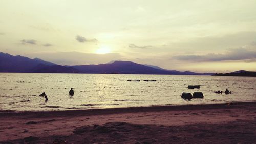 Scenic view of river against sky during sunset