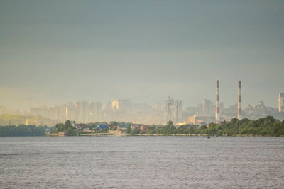 City by sea against sky