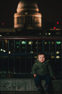 Portrait of baby boy sitting outdoors