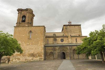 View of bell tower against cloudy sky