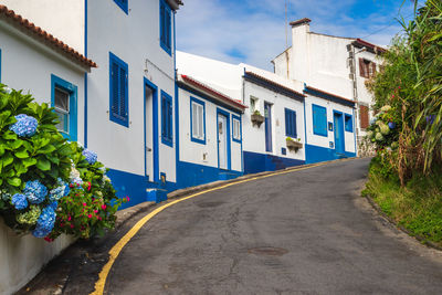 View of a steep picturesque street in los moinhos village, porto formoso, sao miguel island, azores