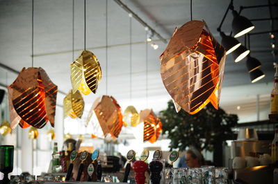 Low angle view of illuminated lanterns hanging in restaurant