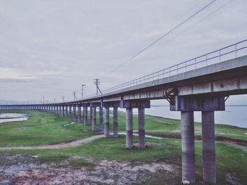 Bridge over landscape against sky