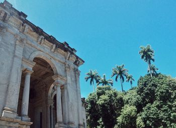 Low angle view of castle against clear blue sky