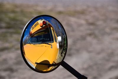 Close-up of yellow sunglasses in car