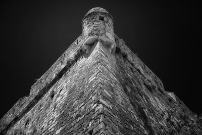 Low angle view of old structure against clear sky