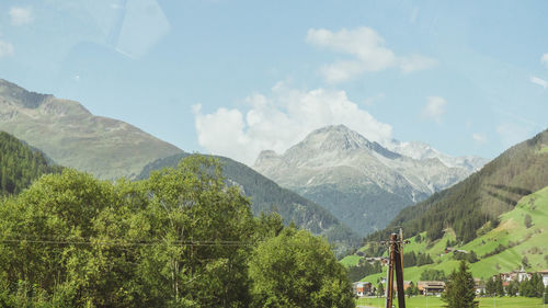 Panoramic shot of trees and mountains against sky