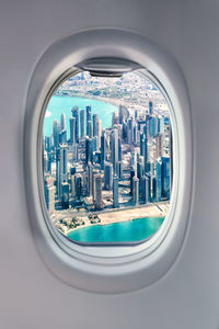 Cityscape seen through airplane window