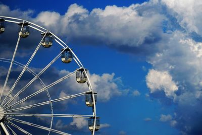 Low angle view of ferris wheel against sky