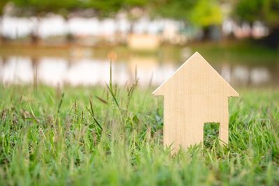 Close-up of house on field