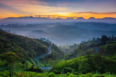 Scenic view of mountains against sky during sunset