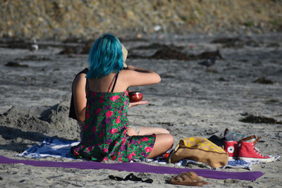 Woman sitting on beach