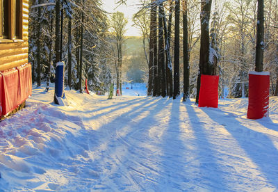 A man is riding in the sun at a ski resort. active recreation concept