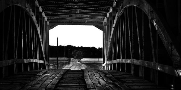 Man seen through bridge