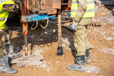 Rear view of man working at construction site