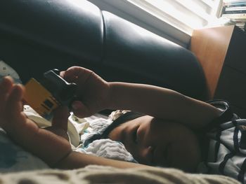 Close-up of toddler in bed