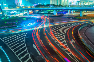 High angle view of light trails on road at night