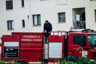 Full length of man standing by building