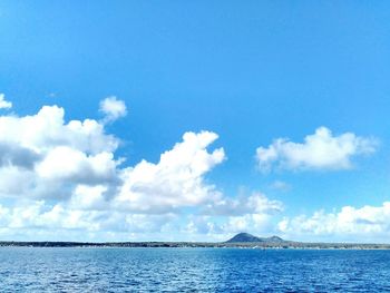 Scenic view of calm sea against blue sky