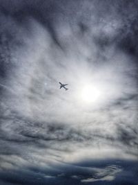 Low angle view of airplane flying in sky