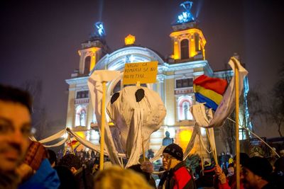 View of statue in city at night