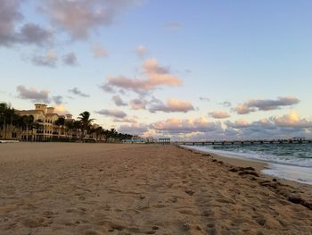 Scenic view of beach against sky during sunset