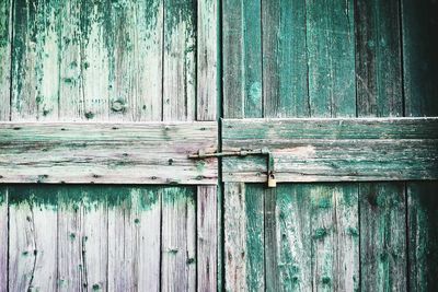 Full frame shot of weathered wooden door