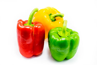 Close-up of bell peppers against white background