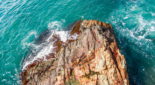 High angle view of rocks on sea